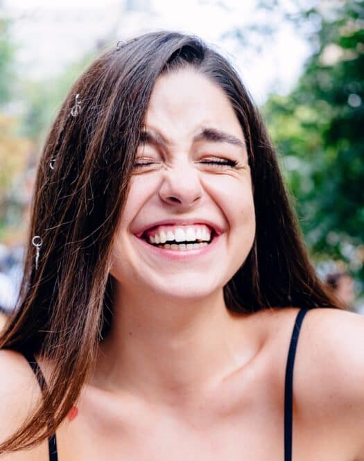 Photo by Vicky Hladynets woman in black spaghetti strap top smiling